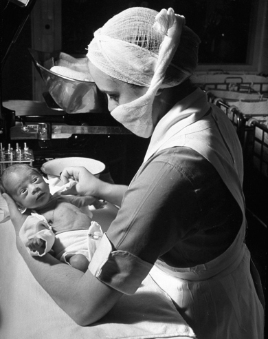 Hansel Mieth - The LIFE Picture Collection/Getty Images/Not published in LIFE. Nurse with premature baby, Boston, 1939.