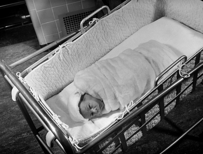 Hansel Mieth - The LIFE Picture Collection/Getty Images/Caption from LIFE. "Ten-minute-old baby swathed in cotton batting."