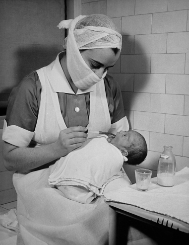 Hansel Mieth - The LIFE Picture Collection/Getty Images/Caption from LIFE. "A medicine dropper is used to feed babies who are too weak to suck a nipple."