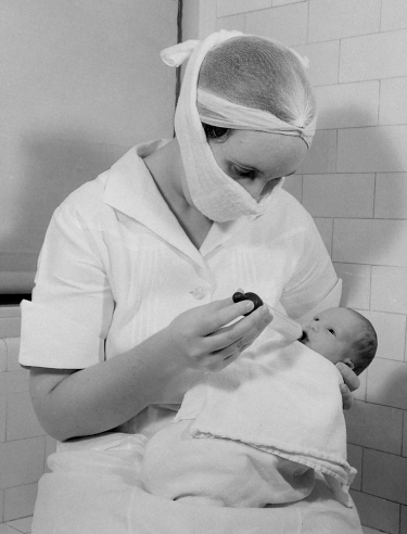 Hansel Mieth - The LIFE Picture Collection/Getty Images/Caption from LIFE. "Combination bottle-dropper with both a bulb and a nipple teaches baby to nurse."